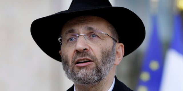 FILE - In this July 12, 2012 file photo, France's Grand Rabbi Gilles Bernheim talks to the media after his meeting with French President Francois Hollande at the Elysee Palace in Paris. French Jewish leaders were holding an urgent meeting to discuss the career fate of France’s chief rabbi Bernheim after he acknowledged “mistakes” amid allegations that he plagiarized texts and lied about his educational background.(AP Photo/Francois Mori, File)