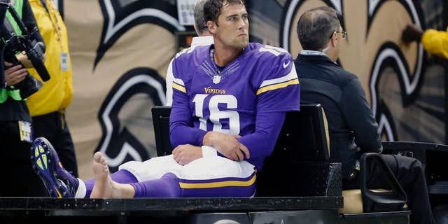Minnesota Vikings quarterback Matt Cassel (16) is carted off the field after being injured in the first half of an NFL football game against the New Orleans Saints in New Orleans, Sunday, Sept. 21, 2014. (AP Photo/Rogelio Solis)