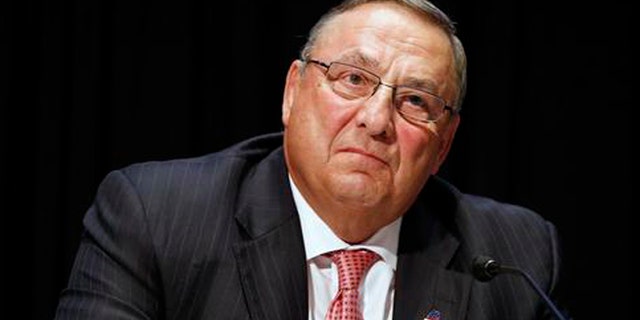 FILE- In this June 7, 2016, file photo, Maine Gov. Paul LePage attends an opioid abuse conference in Boston. LePage is being accused again of making racially insensitive comments, this time by saying photos he's collected in a binder of drug dealers arrested in the state show more than 90 percent of them are black or Hispanic. The governor made the remark at a town hall in North Berwick, Maine, Wednesday, Aug. 24, 2016. (AP Photo/Michael Dwyer, File)
