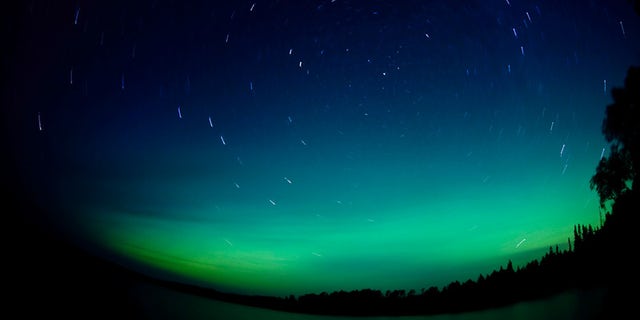 "The Northern Lights were out last night from about 11 to midnight. At times they were bright and well defined. This picture was shot at Elbow Lake near Grand Marais, Minnesota. Even with the streaks, you can still make out the shape of the big dipper pointing right to the North Star." – Photographer Bryan Hansel