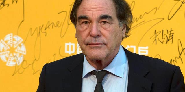 FILE - This April 16, 2014 file photo shows director Oliver Stone at the 4th Beijing International Film Festival held in Beijing, China. On Saturday, May 7, 2016, Stone told University of Connecticut graduates of his academic failures that led him to drop out of school for a while before starting fresh at a new university and ultimately launching a successful film career, during a graduate school commencement address at UConn's main campus in Storrs, Conn. (AP Photo/Ng Han Guan, File)