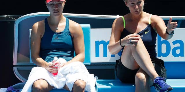 Germany's Angelique Kerber, left, listens to her coach Barbara Rittner during a practice session ahead of the Australian Open tennis championships in Melbourne, Australia, Sunday, Jan. 15, 2017. (AP Photo/Kin Cheung )