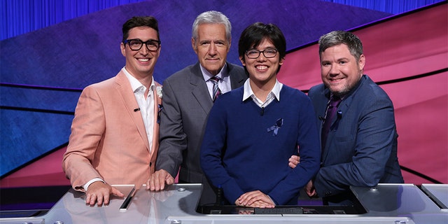 Left to right: Buzzy Cohen, Alex Trebek, Alan Lin and Austin Rogers.