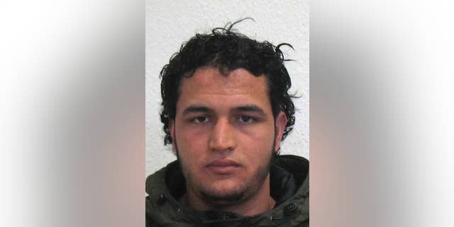 The wanted photo issued by German federal police on Wednesday, Dec. 21, 2016 shows 24-year-old Tunisian Anis Amri. Swiss authorities said Wednesday, Jan. 18, 2017 the gun used by Berlin attacker Anis Amri was imported to Switzerland in the early 1990s. Investigators are still trying to figure out how Amri got hold of the .22-caliber handgun made by now-defunct German manufacturer Erma. (German police via AP)