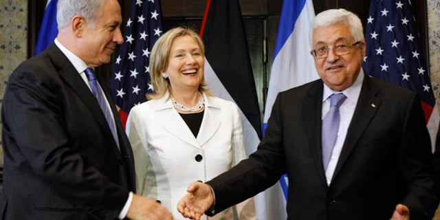 Sept. 14: Israeli Prime Minister Benjamin Netanyahu, left, shakes hands with Palestinian President Mahmoud Abbas, with Secretary of State Hillary Clinton in Egypt.