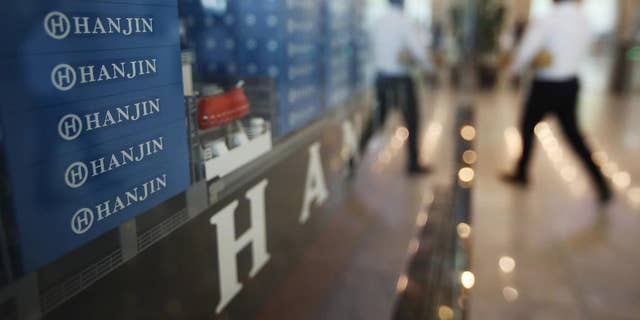 A model of container ship with Hanjin Shipping Co.'s logos is displayed at its head office in Seoul, South Korea, Thursday, Sept. 22, 2016. Hanjin Shipping is to receive as much as $100 million in additional funds to resolve the cargo crisis caused by its slide toward bankruptcy. (Park Dong-ju/Yonhap via AP) KOREA OUT