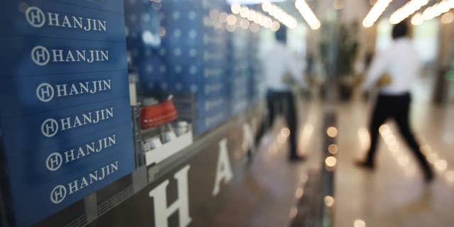 A model of container ship with Hanjin Shipping Co.'s logos is displayed at its head office in Seoul, South Korea, Thursday, Sept. 22, 2016. Hanjin Shipping is to receive as much as $100 million in additional funds to resolve the cargo crisis caused by its slide toward bankruptcy. (Park Dong-ju/Yonhap via AP) KOREA OUT