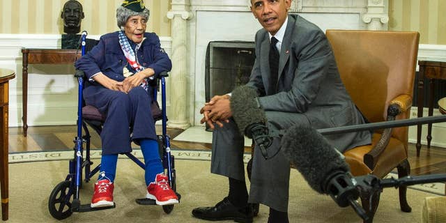 FILE - In this July 17, 2015, file photo, President Barack Obama meets with Emma Didlake, 110, of Detroit, the oldest known World War II veteran, in the Oval Office of the White House in Washington. The Michigan woman who was believed to be the nation's oldest veteran has died a month after meeting the president. The Oakland County medical examiner's office says Didlake died Sunday, Aug. 16 in West Bloomfield, northwest of Detroit. (AP Photo/Evan Vucci, File)