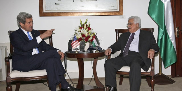 Palestinian President Mahmoud Abbas, right, meets with U.S. Secretary of State John Kerry in the West Bank city of Ramallah, Sunday April 7, 2013. (AP Photo / Mohamed Torokman)