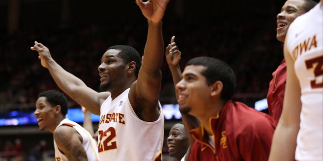 Iowa State forward Anthony Booker (22) and the rest of the Iowa State bench celebrate as Iowa State guard Nkereuwem Okoro (not shown) hits a three-pointer late in the second half of their NCAA college basketball game against TCU Saturday, Feb. 16, 2013, at Hilton Coliseum in Ames, Iowa. Iowa State won the game 87-53. (AP Photo/Justin Hayworth)