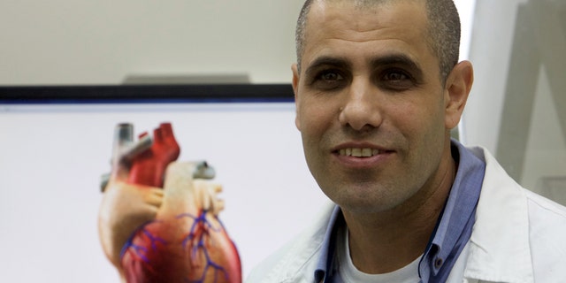 File photo: Professor Tal Dvir speaks during their interview with Reuters on his team's development of a 3D printed patch comprised of lab-grown heart tissue and nano-electronics that could potentially revolutionize the treatment of heart disease, at a laboratory in Tel Aviv University March 16, 2016. Picture taken March 16, 2016. (REUTERS/ Nir Elias)
