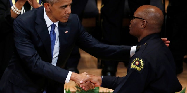 President Obama shakes hands with Dallas police chief David Brown during a memorial service following the multiple police shootings in Dallas