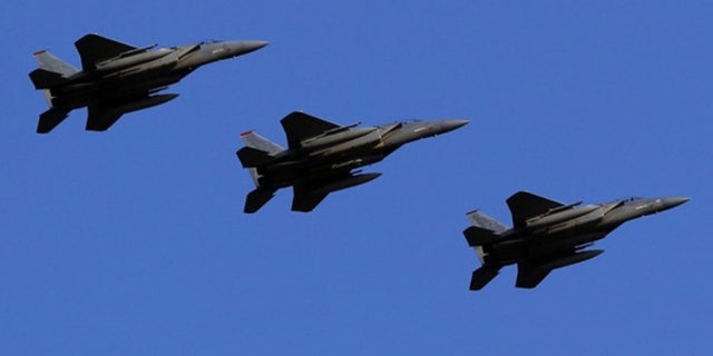 Feb. 25: U.S. Air Force F-15 Eagle fighter jets fly over Kadena Air Base in Japan.