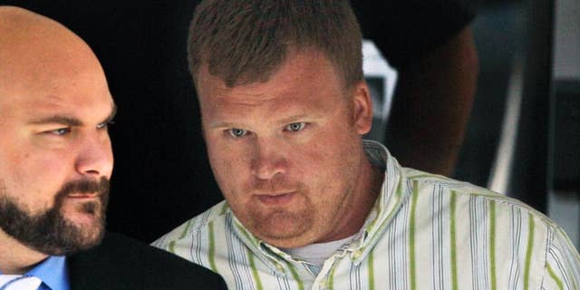 FILE - In this June 20, 2012, file photo, Matt Sandusky, right, adopted son of former Penn State assistant coach Jerry Sandusky, leaves the Centre County Courthouse in Bellefonte, Pa., where his father was being tried on charges of child sexual abuse involving 10 boys over a period of 15 years. Matt Sandusky spoke out Friday, Dec. 5, 2014, about his two abusive fathers and called sexual abuse the "single worst health epidemic that children face." (AP Photo/Gene J. Puskar, File)