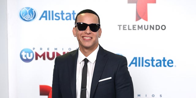 Daddy Yankee arrives for Telemundo's Premios Tu Mundo Awards at American Airlines Arena on August 15, 2013 in Miami, Florida.