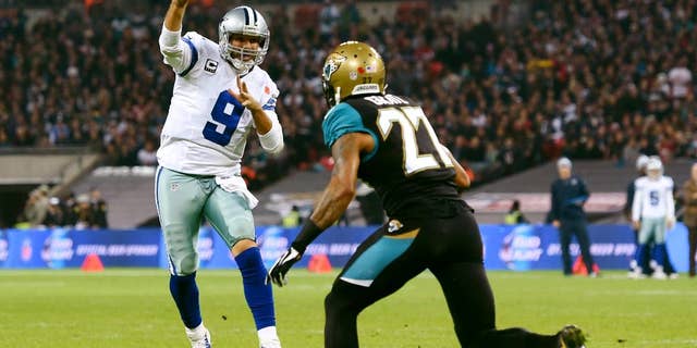 Jacksonville Jaguars wide receiver Cecil Shorts (84) is pursued by Dallas Cowboys defensive back Sterling Moore (26) and free safety J.J. Wilcox (27) during the first half of an NFL football game at Wembley Stadium, London, Sunday, Nov. 9, 2014. (AP Photo/Tim Ireland)
