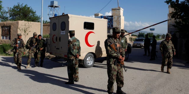 Four guards were killed in Afghanistan on Monday, days after a seperate attack left more than 100 people dead.