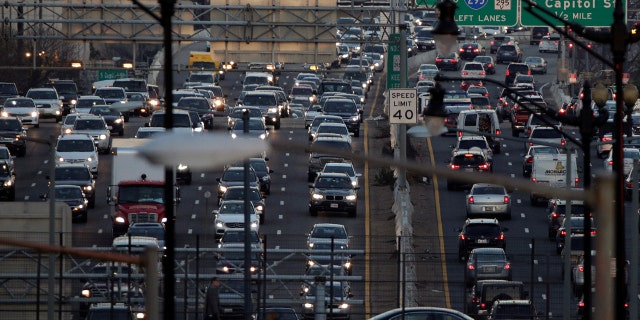 Rush-hour traffic passes through Washington, U.S., December 20, 2016.