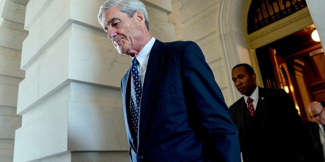 FILE - In this June 21, 2017, file photo, former FBI Director Robert Mueller, the special counsel probing Russian interference in the 2016 election, departs Capitol Hill following a closed door meeting in Washington. A 2001 Justice Department memo warned that no nation, including the United States, was immune from the threat posed by Russian organized crime. The special counsel investigation is bringing attention to Russian efforts to meddle in democratic processes, the type of intelligence gathering that in the past has relied on hired hackers. Its not clear how much the probe by Mueller will center on the criminal underbelly of Moscow, but hes already picked some lawyers with experience confronting organized crime. (AP Photo/Andrew Harnik, File)