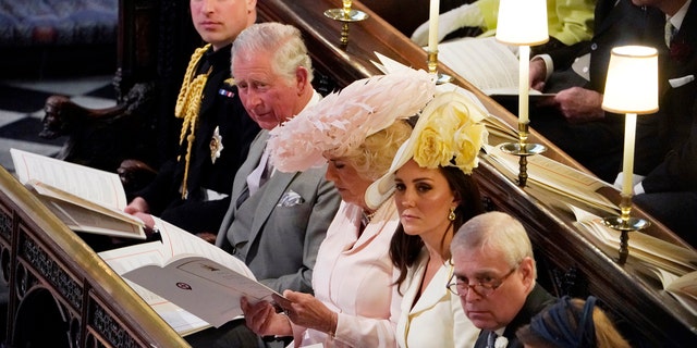 From left, Britain's Prince William, Prince Charles, Camilla Duchess of Cornwall, Kate Duchess of Cambridge, Prince Andrew and Princess Beatrice at the wedding ceremony of Prince Harry and Meghan Markle at St. George's Chapel in Windsor Castle in Windsor, near London, England, Saturday, May 19, 2018.