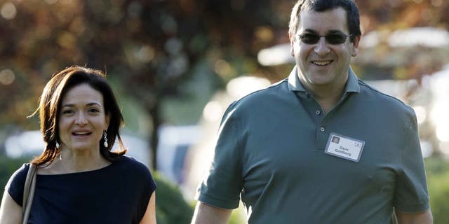 Sheryl Sandberg, COO of Facebook, and her husband David Goldberg in a 2013 file photo.