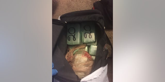 Officers discovered 33 pounds of cocaine inside Hugo Rueda vehicle.