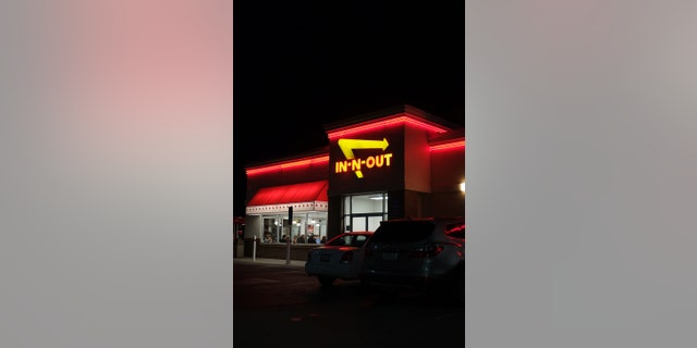 Rancho Cordova, California, USA - December 6, 2016:View at the In-n-out Burger restaurant from the parking lot, at night. Patrons sitting and dinning inside. In-N-Out Burger, Inc. is a regional chain of fast food restaurants with locations primarily in the American Southwest and Pacific coast.