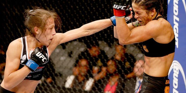 SAN JOSE, CA - JULY 26: (L-R) Joanna Jedrzejczyk punches Julianna Lima in their womens strawweight bout during the UFC Fight Night event at SAP Center on July 26, 2014 in San Jose, California. (Photo by Josh Hedges/Zuffa LLC/Zuffa LLC via Getty Images)