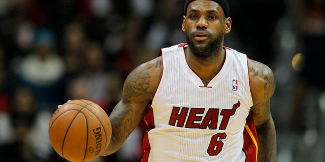 Miami Heat small forward LeBron James (6) drives down the court during the first period of an NBA basketball game against the Atlanta Hawks in Atlanta, Monday, Jan. 20, 2014. (AP Photo/Todd Kirkland)