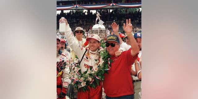 FILE - In this May 30, 1999 file photo, Indianapolis 500 winner Kenny Brack of Sweden, left, and car owner A.J. Foyt of Houston celebrate Brack's win in Victory Lane after the 83rd running of the auto race in Indianapolis.  (AP Photo/Al Behrman, File)