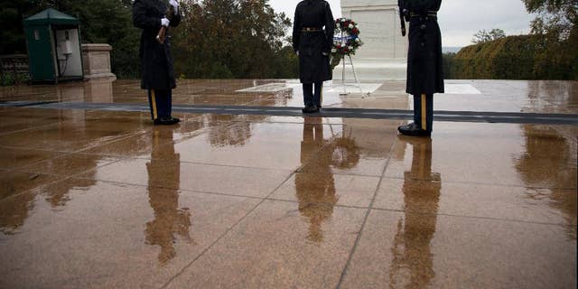Tomb guards perform the Changing of the Guard at the Tomb of the Unknown Soldier in Arlington National Cemetery in Arlington, Va., Wednesday, Oct. 22, 2014. The military increased security Wednesday at the Tomb of the Unknowns at Arlington National Cemetery after fatal shootings at a Canadian war memorial and Parliament, even though the FBI and the Homeland Security Department said there was no specific threat against the U.S. (AP Photo/Manuel Balce Ceneta)