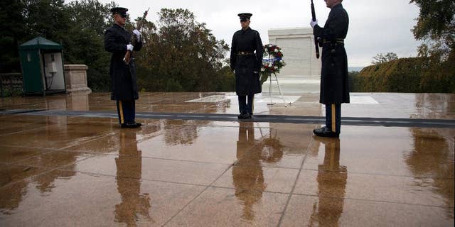 Tomb guards perform the Changing of the Guard at the Tomb of the Unknown Soldier in Arlington National Cemetery in Arlington, Va., Wednesday, Oct. 22, 2014. The military increased security Wednesday at the Tomb of the Unknowns at Arlington National Cemetery after fatal shootings at a Canadian war memorial and Parliament, even though the FBI and the Homeland Security Department said there was no specific threat against the U.S. (AP Photo/Manuel Balce Ceneta)