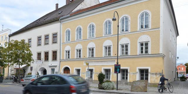 FILE - This Sept. 27, 2012 file picture shows an exterior view of Adolf Hitler's birth house , front, in Braunau am Inn, Austria. Austria’s interior minister says Saturday June 11, 2016 he can imagine having the house where Adolf Hitler was born demolished, calling it “the cleanest solution.” The Austrian government wants to expropriate the house in Braunau am Inn where the future Nazi leader was born in 1889 to keep it from falling into the wrong hands. (AP Photo / Kerstin Joensson)