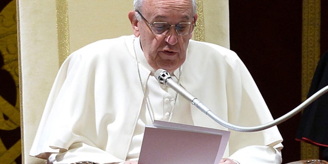 Pope Francis delivers his message during the annual Christmas greetings to the Vatican bureaucracy in the Clementina Hall, at the Vatican, Monday, Dec. 21, 2015. Francis has issued a Christmas-time "catalogue of virtues" for his closest collaborators to follow after having excoriated them last year for a host of sins that he said were compromising the Catholic Church's work. (Alberto Pizzoli/Pool Photo via AP)