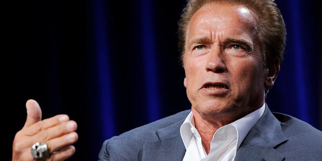 Former California Gov. Arnold Schwarzenegger, the subject of a forthcoming ESPN short film, answers a question during the ESPN Films "30 for 30 Shorts" TCA panel discussion at the Beverly Hilton hotel on Friday, Aug. 3, 2012 in Beverly Hills, Calif. The film will focus on Schwarzenegger's teenage years in the Austrian army. (Photo by Chris Pizzello/Invision/AP)