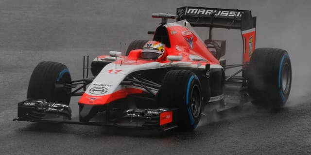 Marussia driver Jules Bianchi of France steers his car during the Japanese Formula One Grand Prix at the Suzuka Circuit in Suzuka, central Japan, Sunday, Oct. 5, 2014. Bianchi has been taken to hospital and is unconscious following a crash during the Japanese Grand Prix. (AP Photo/Shuji Kajiyama)