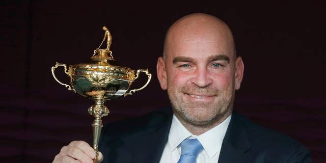 FILE - This is a Wednesday, Dec., 7, 2016 file photo of the newly appointed 2018 Europe Ryder Cup captain Thomas Bjorn holds the Ryder Cup as he poses for photographs at a hotel near Heathrow Airport, London during a media event. Europe’s team for the 2018 Ryder Cup in France will have an extra captain’s pick and is set to contain more in-form players following a revamp of the qualifying system in the wake of a heavy loss to the United States last year. The aim is clear, to give captain Thomas Bjorn the best possible team to regain the cup. (AP Photo/Alastair Grant/File)