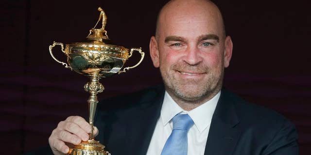 FILE - This is a Wednesday, Dec., 7, 2016 file photo of the newly appointed 2018 Europe Ryder Cup captain Thomas Bjorn holds the Ryder Cup as he poses for photographs at a hotel near Heathrow Airport, London during a media event. Europe’s team for the 2018 Ryder Cup in France will have an extra captain’s pick and is set to contain more in-form players following a revamp of the qualifying system in the wake of a heavy loss to the United States last year. The aim is clear, to give captain Thomas Bjorn the best possible team to regain the cup. (AP Photo/Alastair Grant/File)