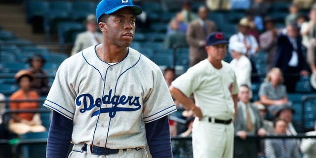 This film image released by Warner Bros. Pictures shows Chadwick Boseman as Jackie Robinson in a scene from "42."