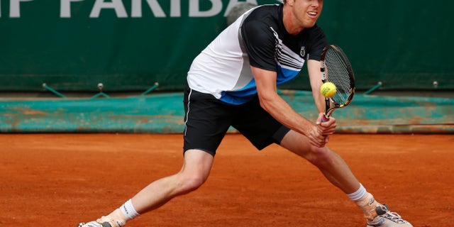 Sam Querrey of the U.S. returns against Gilles Simon of France in their third round match at the French Open tennis tournament, at Roland Garros stadium in Paris, Friday, May 31, 2013. (AP Photo/Petr David Josek)