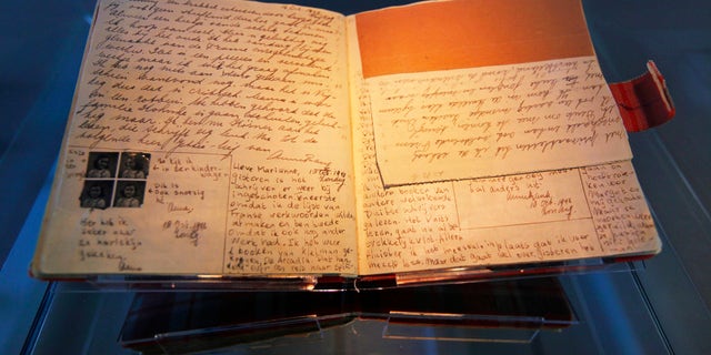 The well-known first diary of Anne Frank sits on display in the Anne Frank House in Amsterdam April 28, 2010. (REUTERS/Cris Toala Olivares)