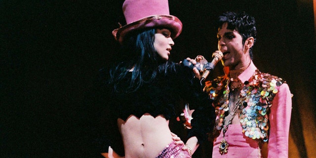 LONDON, UNITED KINGDOM - MARCH 4: Mayte Garcia and Prince perform on stage on 'The Ultimate Live Experience' tour at Wembley Arena on March 4th, 1995 in London, United Kingdom. (Photo by Peter Still/Redferns)