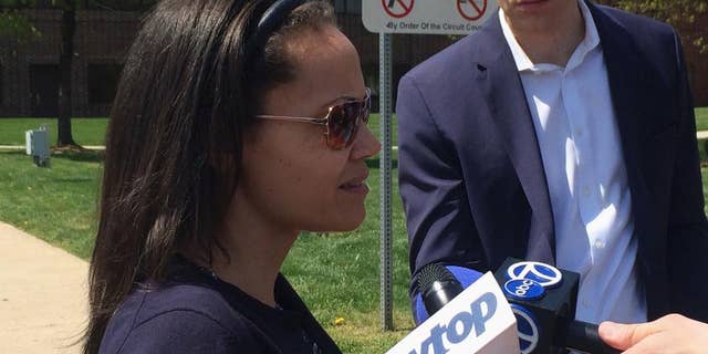 Hera McLeod talks to reporters in Manassas, Va., Thursday, April 13, 2017, after her ex-fiancé, Joaquin Shadow Rams, was convicted of murdering their 1-year-old son. A judge has convicted a Virginia father of murdering his 1-year-old son in an effort to collect on more than $500,000 in life insurance he had taken out on the boy. (AP Photo/Matthew Barakat)