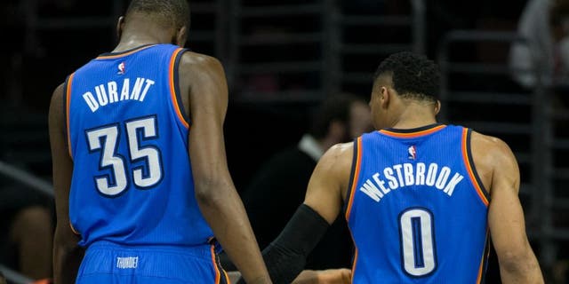 SAN ANTONIO, TX - MAY 10: Russell Westbrook #0 of the Oklahoma City Thunder high fives Kevin Durant #35 during the game against the San Antonio Spurs in Game Five of the Western Conference Semifinals during the 2016 NBA Playoffs on May 10, 2016 at the AT&T Center in San Antonio, Texas. NOTE TO USER: User expressly acknowledges and agrees that, by downloading and or using this photograph, user is consenting to the terms and conditions of the Getty Images License Agreement. Mandatory Copyright Notice: Copyright 2016 NBAE (Photos by Layne Murdoch/NBAE via Getty Images)