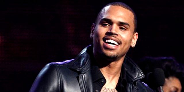 Feb. 12, 2012: In this file photo, Chris Brown accepts the award for best R&amp;B album for "F.A.M.E." during the 54th annual Grammy Awards in Los Angeles.