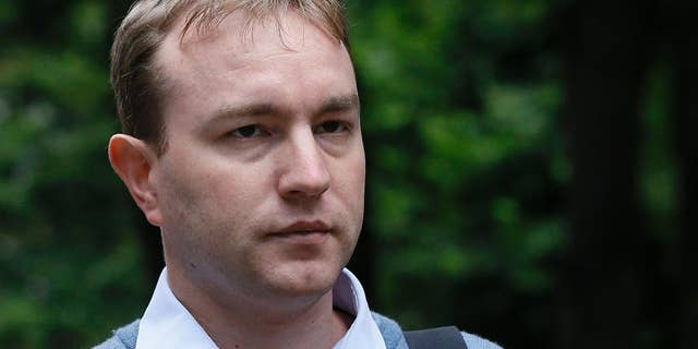 FILE - This is a Monday, July 27, 2015 file photo of Tom Hayes as arrives at Southwark Crown Court in London, Monday, July 27, 2015. A British jury found former Citibank and UBS trader Tom Hayes guilty of being the ringmaster in the manipulation of a key interest rate, the London Interbank Lending Rate, or Libor. The jury on Monday Aug. 3, 2015 found 35-year-old Hayes, who specialized in products pegged to yen-denominated Libor, guilty of manipulating the rate from 2006 to 2010. He was charged with conspiring with other traders — but he says he was made a scapegoat for a common practice. (AP Photo/Kirsty Wigglesworth, File)