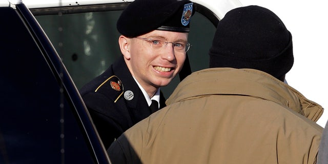 Nov. 28, 2012: Army Pfc. Bradley Manning, center, steps out of a security vehicle as he is escorted into a courthouse in Fort Meade, Md., for a pretrial hearing.