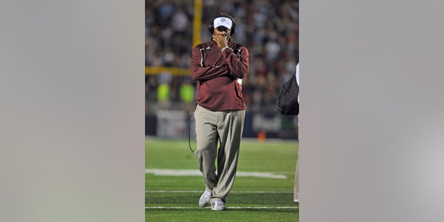 Texas A&M coach Kevin Sumlin during a timeout during the fourth quarter of an NCAA college football game on Saturday, Oct. 12, 2013, in Oxford, MS. #9 Texas A&M won 41-38. (AP Photo/ The Daily Mississippian, Austin McAfee)