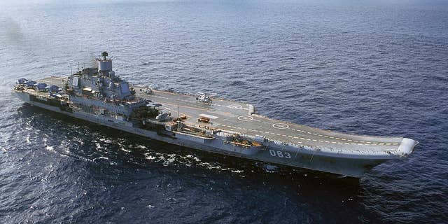 FILE - In this 2004 file photo the Admiral Kuznetsov carrier seen in the Barents Sea, Russia. Russian Defense Minister Sergei Shoigu said Wednesday, Sept. 21, 2016, that the navy will send its only aircraft carrier, the Admiral Kuznetsov, to the eastern Mediterranean to join other Russian ships deployed near the Syrian shores.(AP Photo, file)