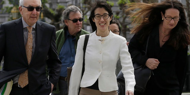 Mar. 17, 2015: Ellen Pao, center, walks to Civic Center Courthouse in San Francisco (AP)